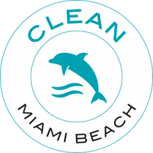 Clean Miami Beach logo with a dolphin jumping over waves in a circular teal border.
