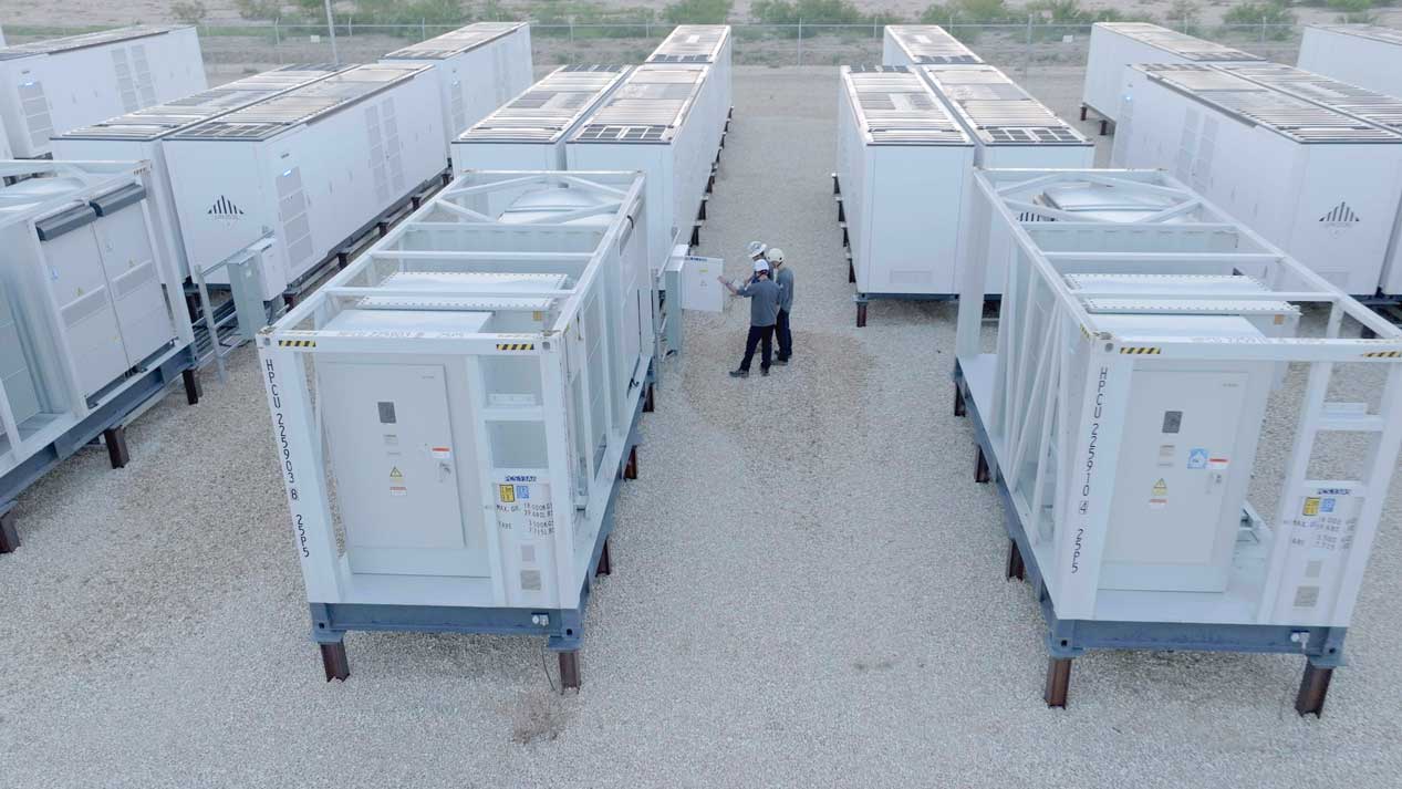Two Workers Assessing Industrial Generators