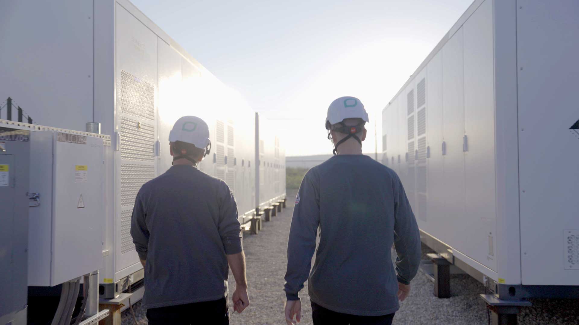 Workers at a battery storage site