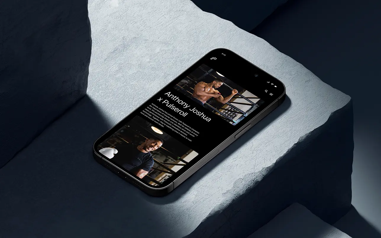 Mobile web interface design shown on an iPhone 15 Pro mockup over a dark concrete texture, highlighting the responsive campaign layout