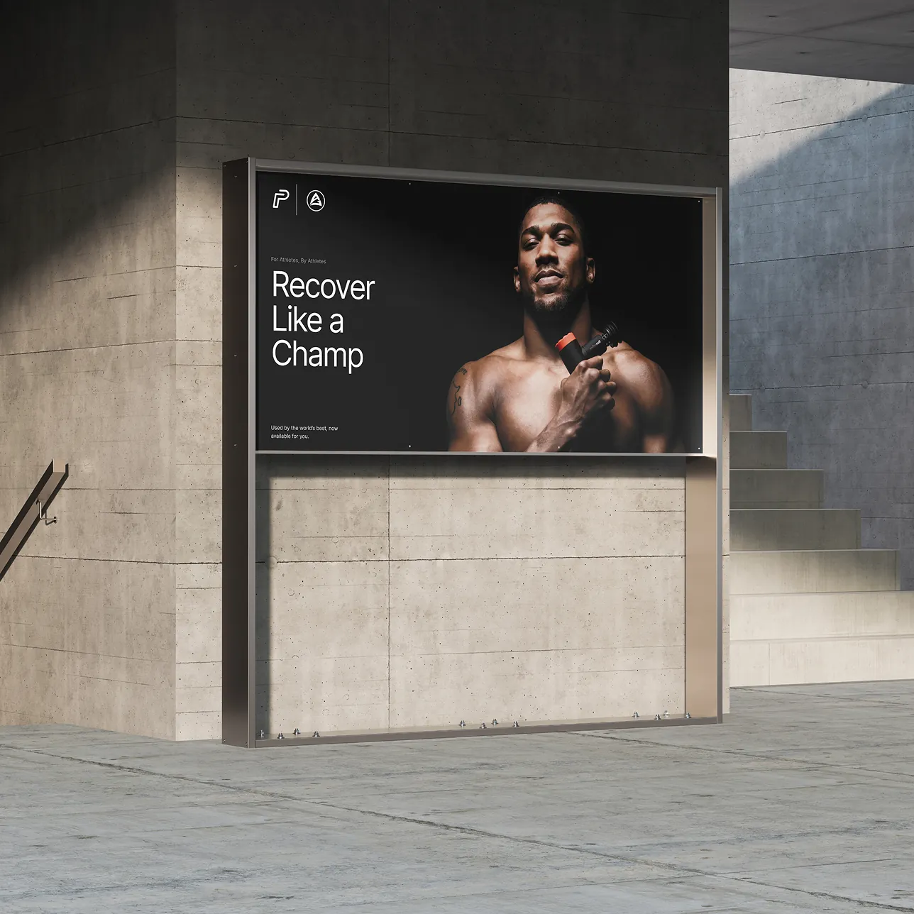 Large format outdoor billboard mockup mounted on a concrete wall, displaying the Anthony Joshua campaign key art