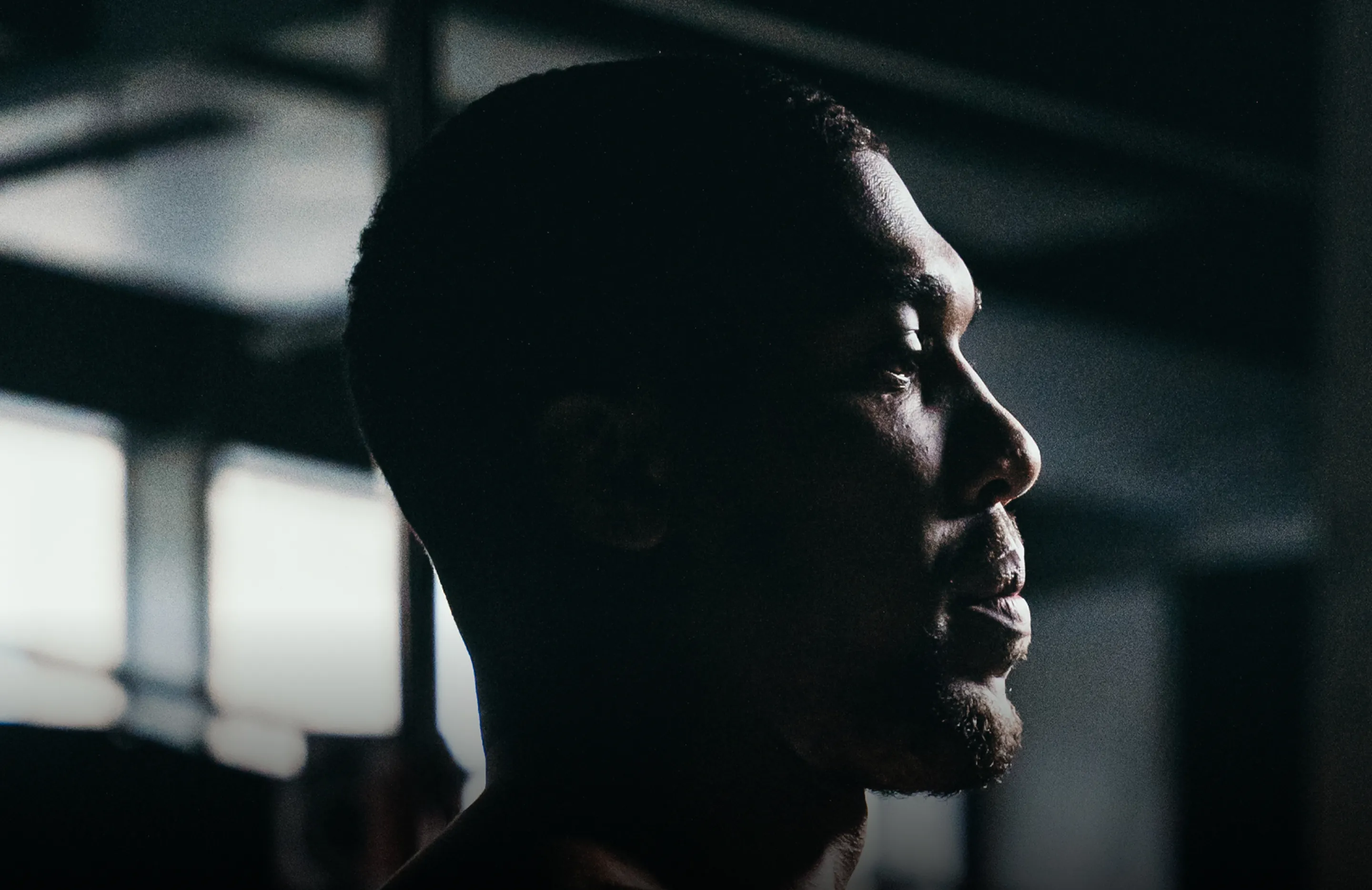 Cinematic high-contrast profile silhouette of Anthony Joshua for the Pulseroll campaign identity