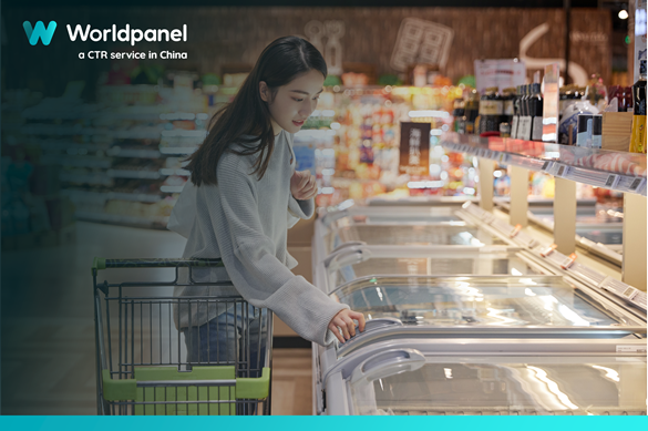 A woman with a shopping cart examining items in a grocery store’s freezer section, with a Worldpanel branding overlay on the left.
