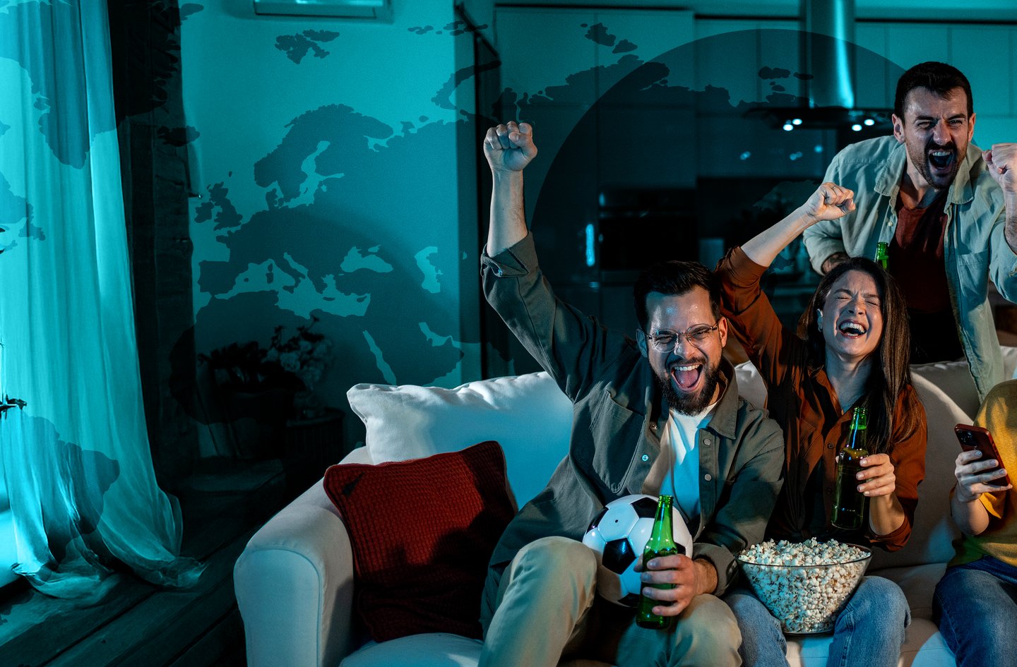 A group of friends watching a game eating snacks.