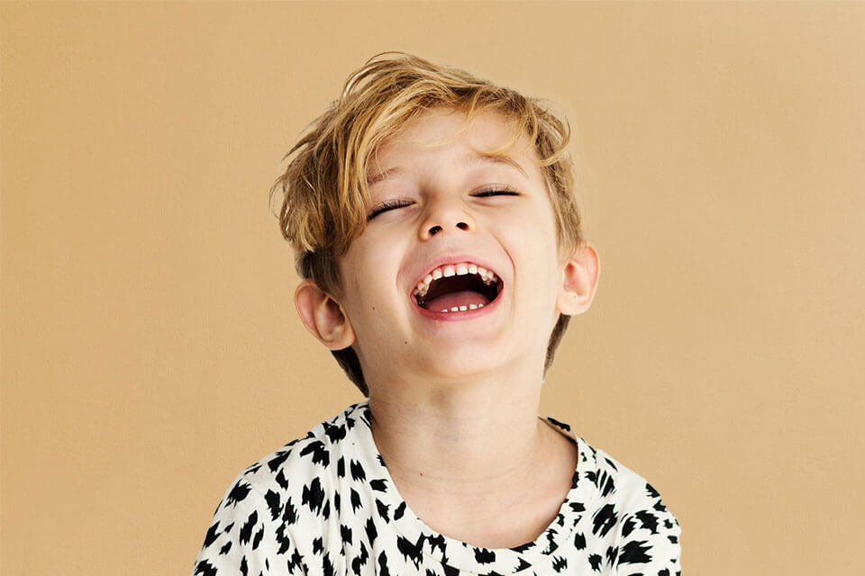 little boy laughing