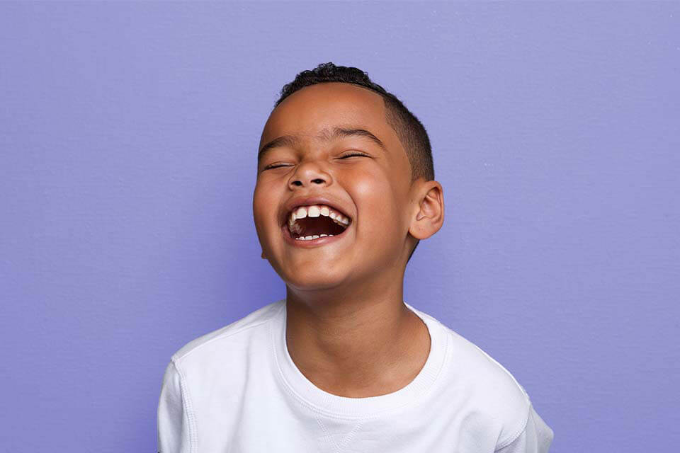 little boy laughing