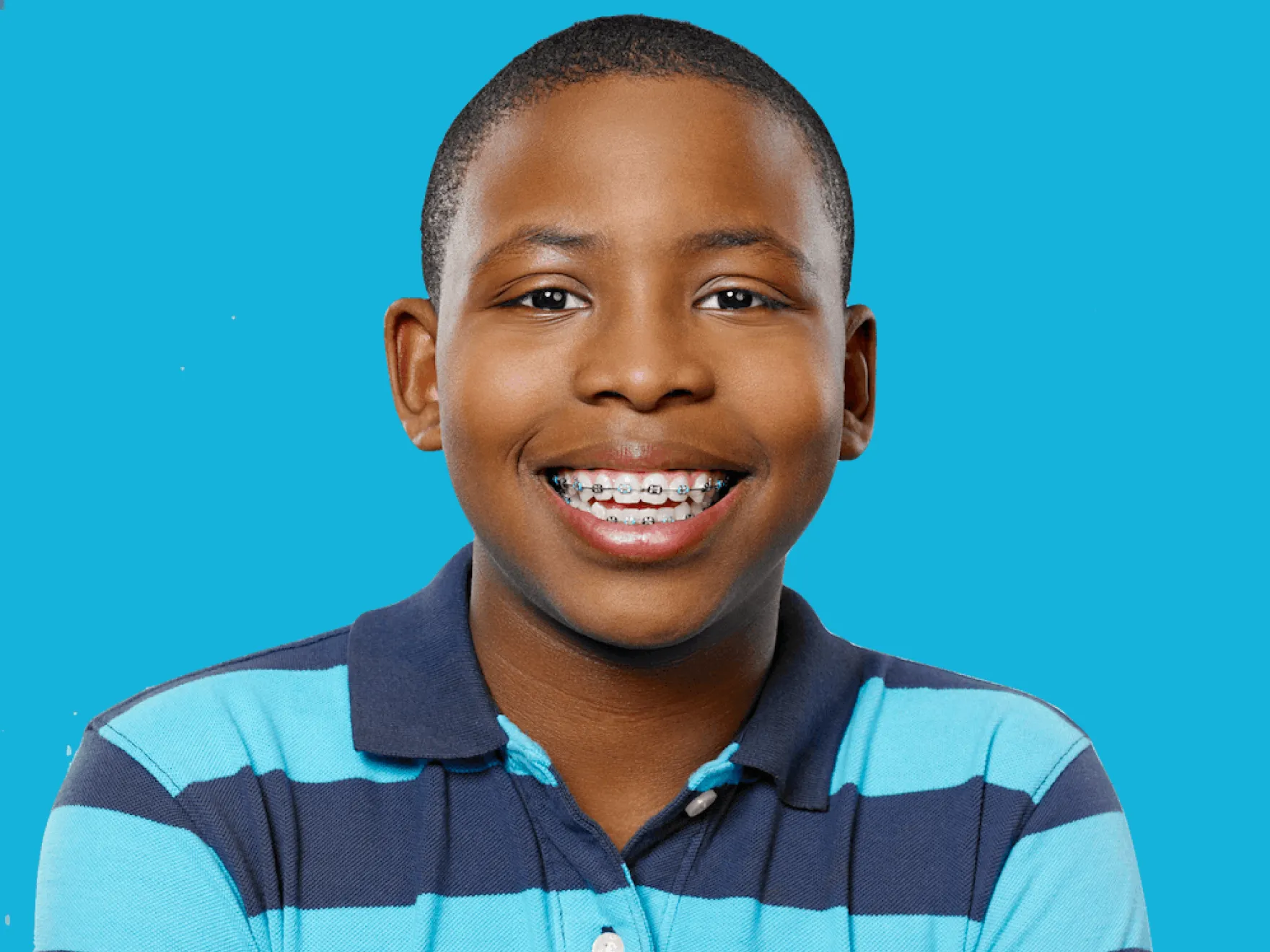 boy with braces smiling