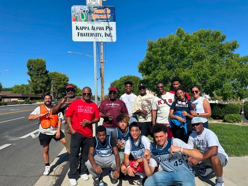 LPAC brothers, youth, and community partners during a Team Up Lancaster street cleanup