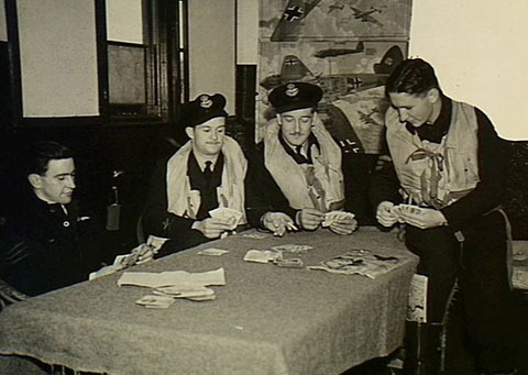 Killing time on readiness. L-R: Lawrie Cronin, Tommy Swift, Johnny Barrien, Rusty Leith