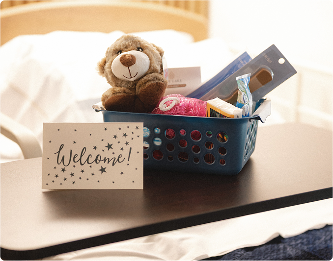 photo of a welcome card with a basket behind it