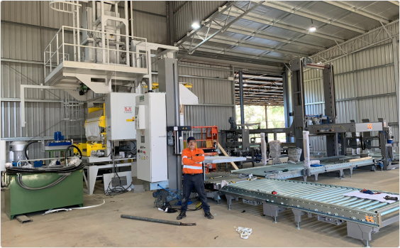 INCAS Engineer Mario posing in front of an installed production line