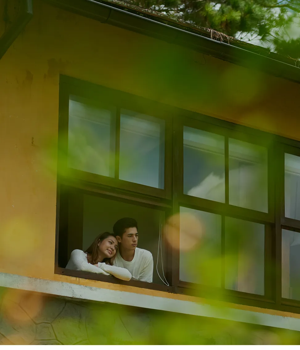 A couple enjoying the view from their rented apartment