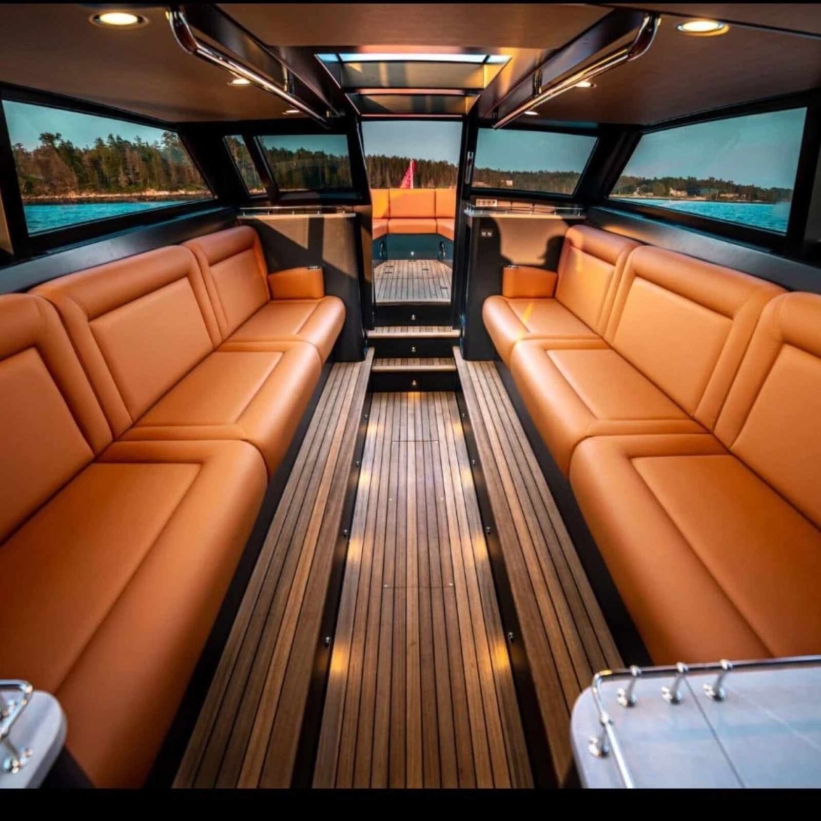 Interior view of a luxury yacht featuring soft marine furnishings and custom boat upholstery by Alfred’s by Sea, with premium marine upholstery throughout the cabin.