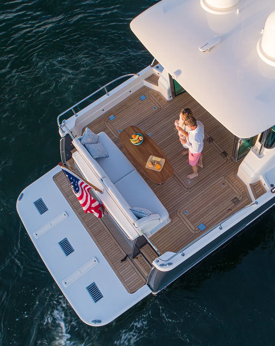 Family enjoying time together on a yacht featuring Alfred’s signature marine cushions — crafted with care by a Maine upholstery studio rooted in tradition and craftsmanship.