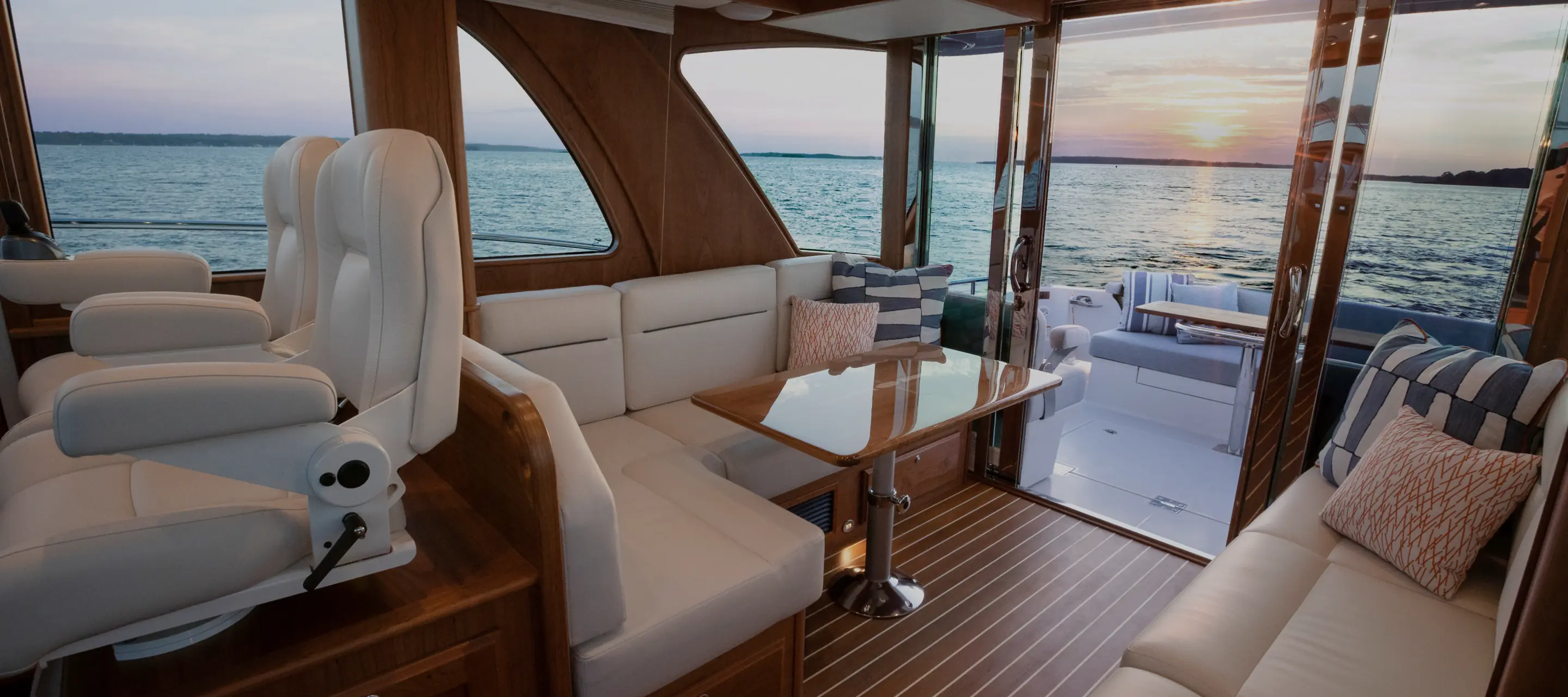 Inside a yacht at sunset showcasing Alfred’s handcrafted marine upholstery — a Maine upholstery studio dedicated to timeless craftsmanship and custom detail.