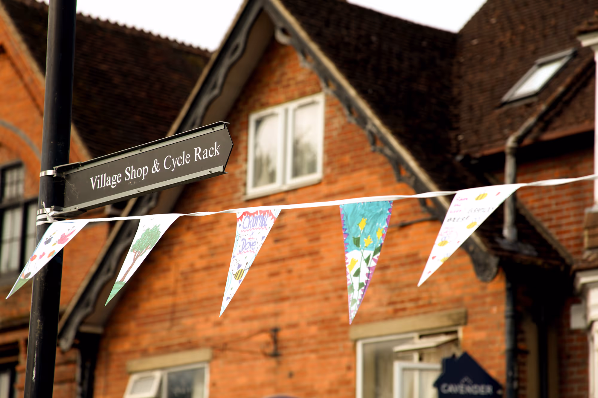 Discover Bramley bunting in front of a storefront