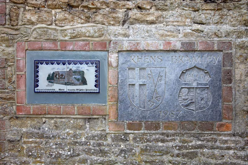 Old brick wall with stone carvings