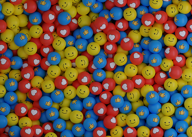 A large pile of colorful plastic balls featuring cheerful smiley faces, creating a playful and vibrant scene
