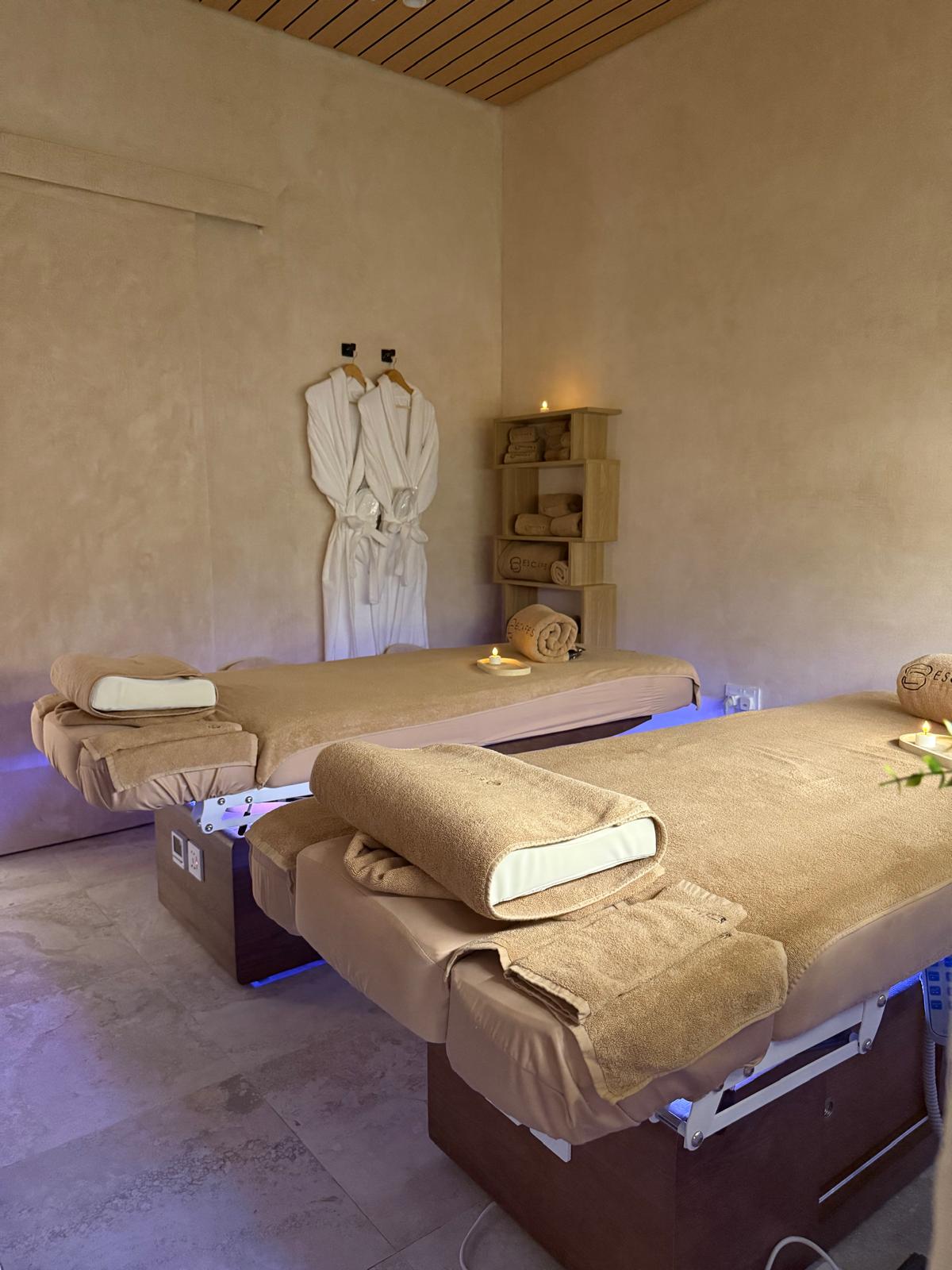 Escape 8 Spa couples treatment room with two massage beds side by side, set up for a Mother & Child Massage.