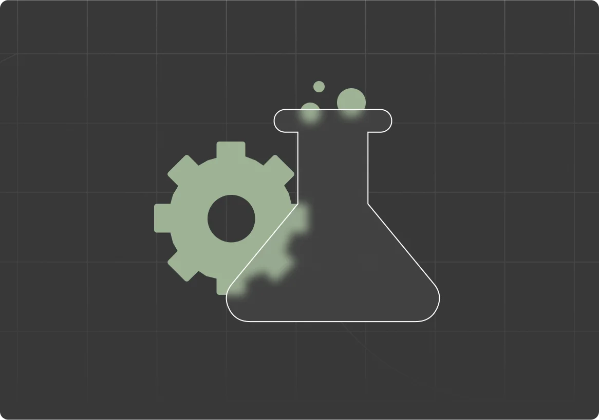 An erlenmeyer flask in front of a gear