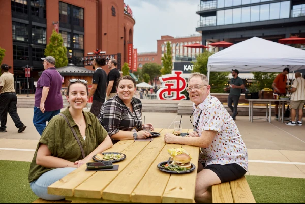 Team members socializing together over a casual meal.
