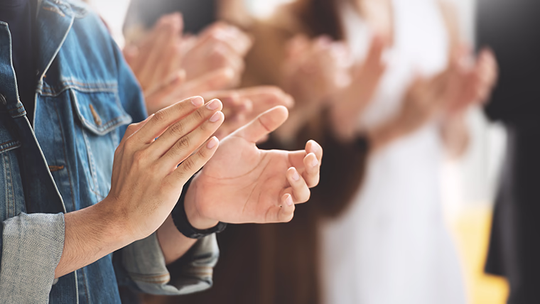 people clapping shining light awards