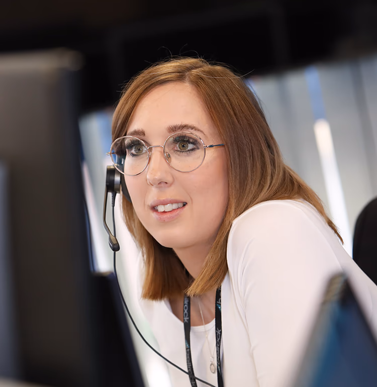 Bellrock person working in office wearing headset