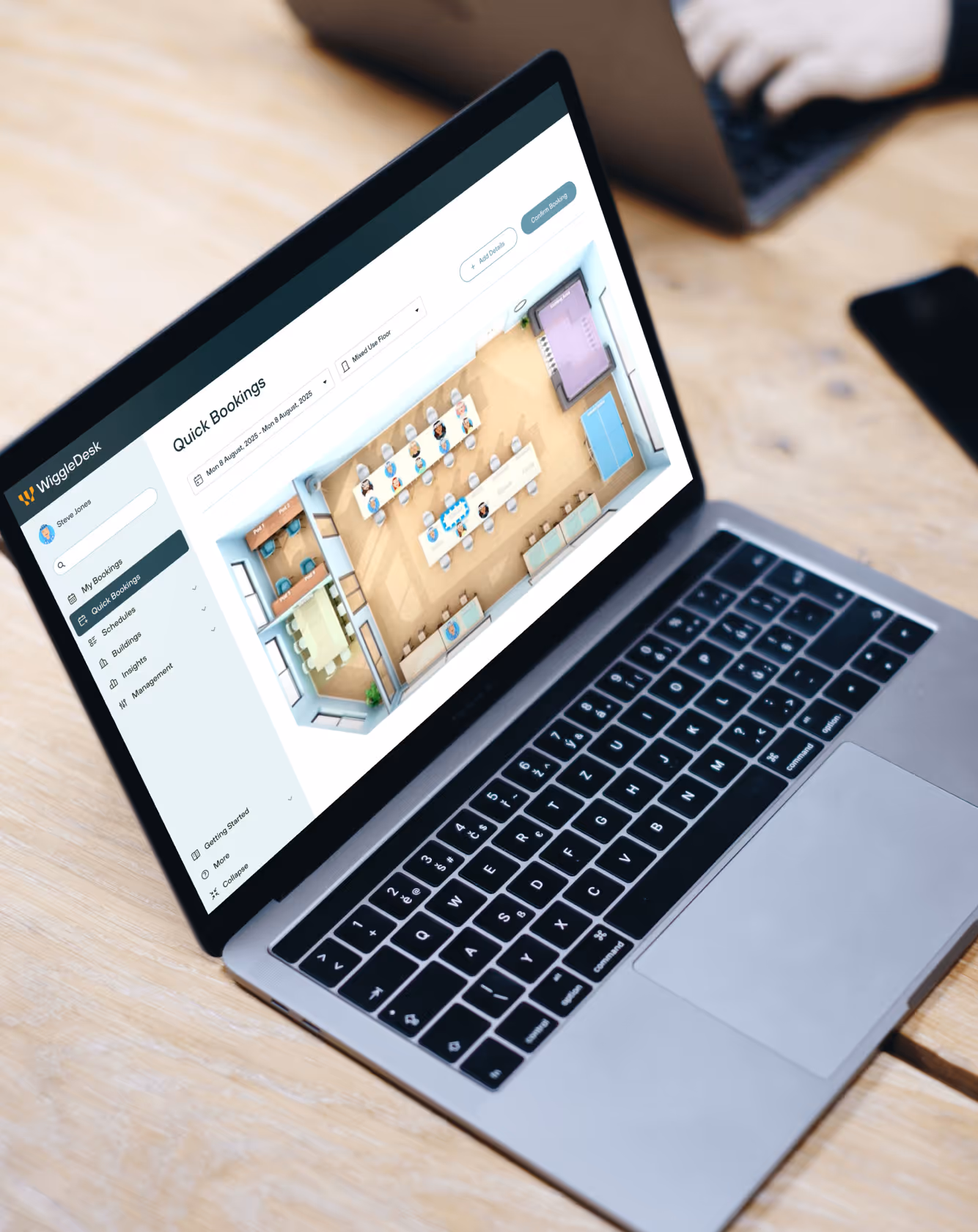 A laptop showing a WiggleDesk floor plan.