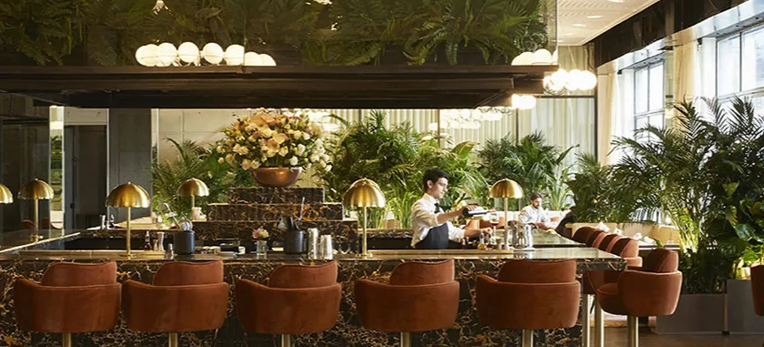 Chic bar area at Spring Place with elegant lighting and curated design details