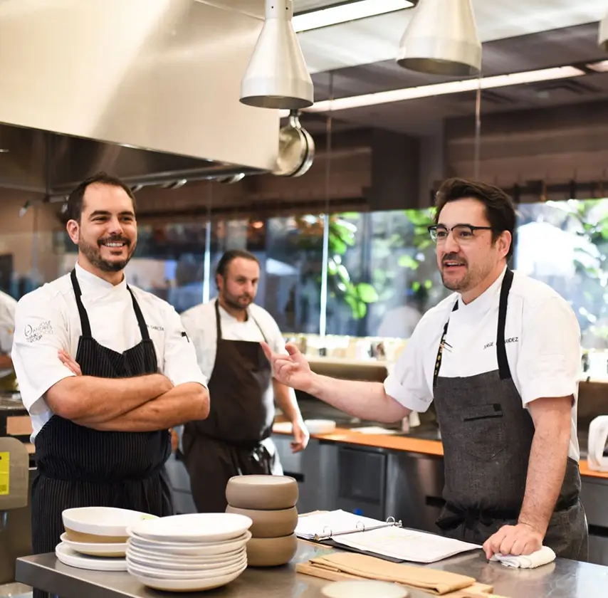 Portrait of the culinary team at Spring Place in a professional kitchen setting
