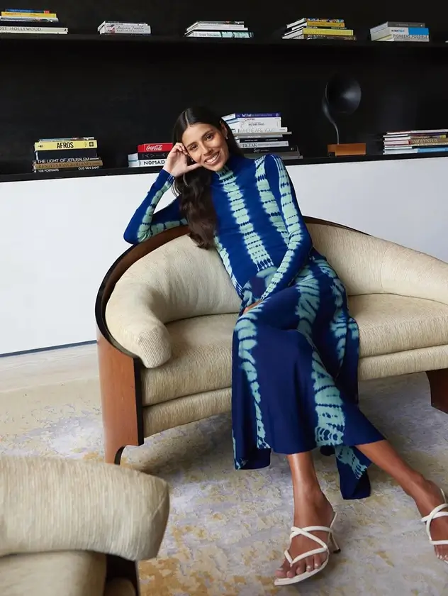 Portrait of a woman seated in an armchair at Spring Place, captured in a refined and elegant setting