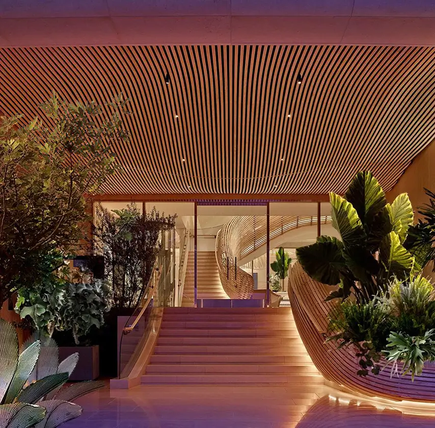 Illuminated staircase at Spring Place with warm ambient lighting and modern design