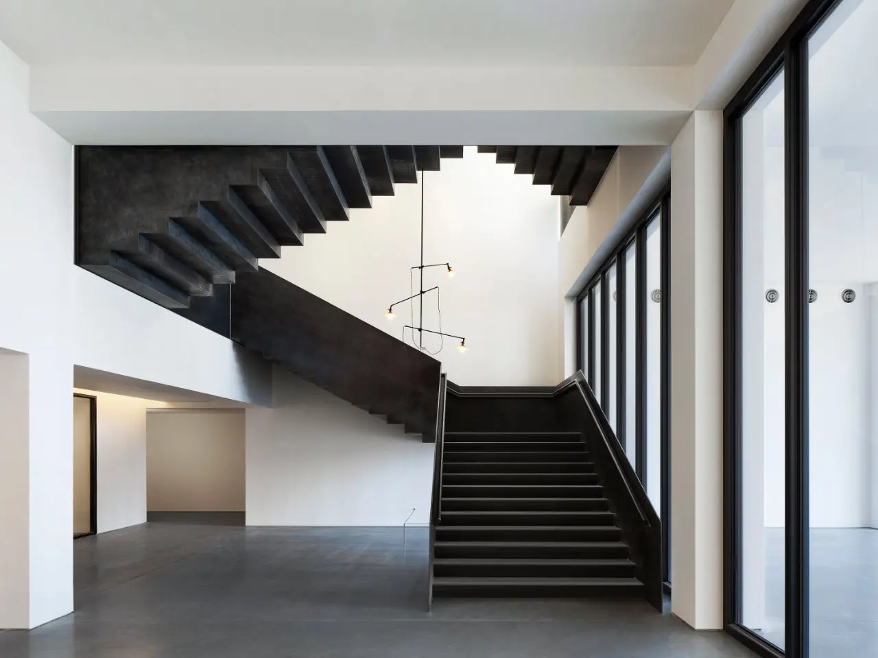 Architectural staircase at Spring Place with modern, sculptural design