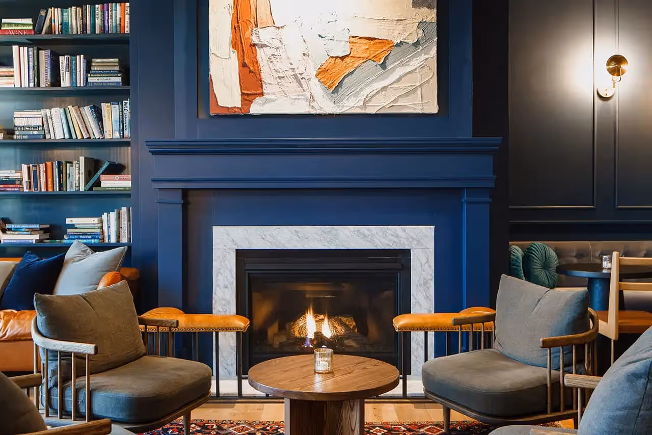 Chairs and fireplace inside The Lake House on Canandaigua