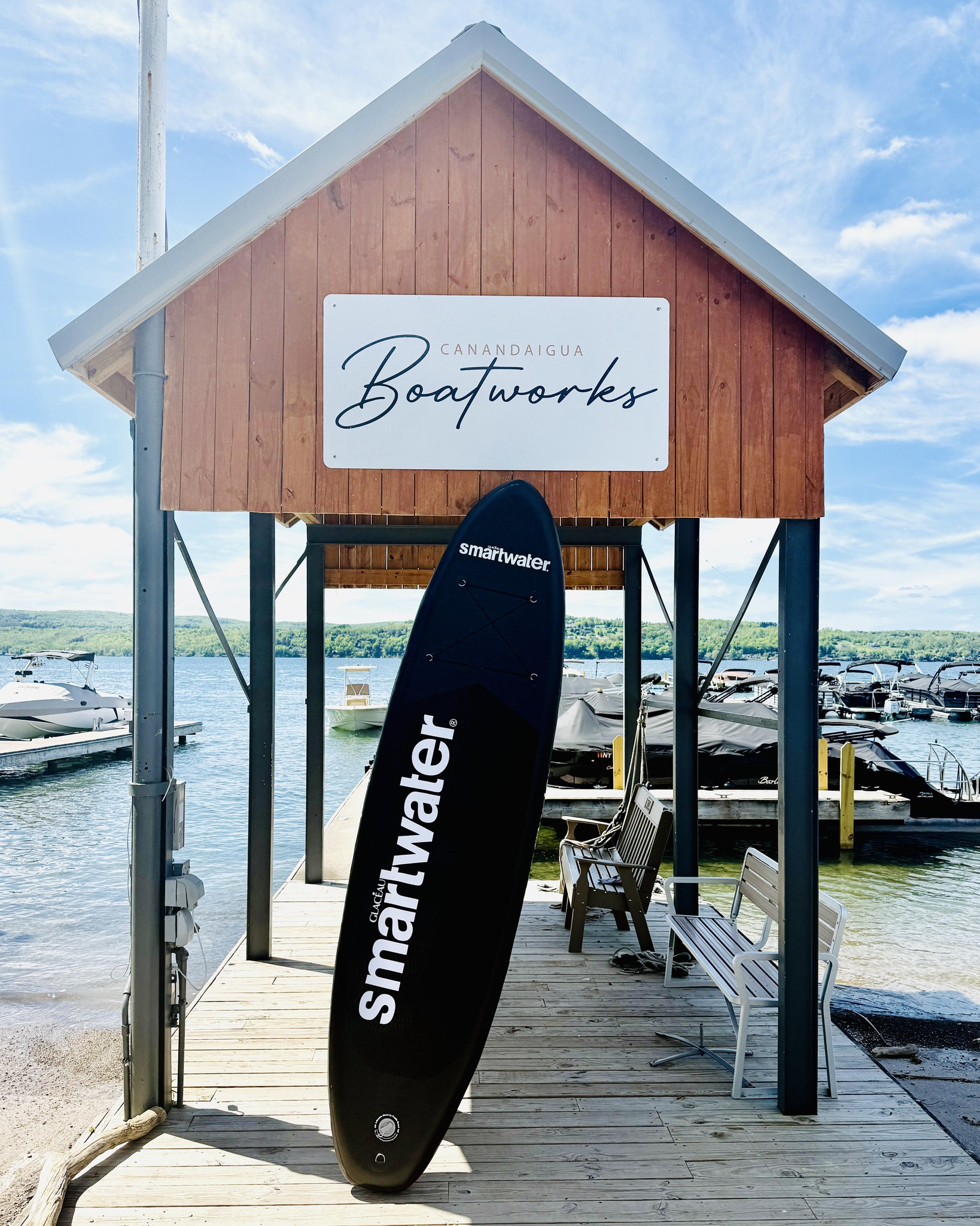 Paddle board and Canandaigua Boat Works Sign