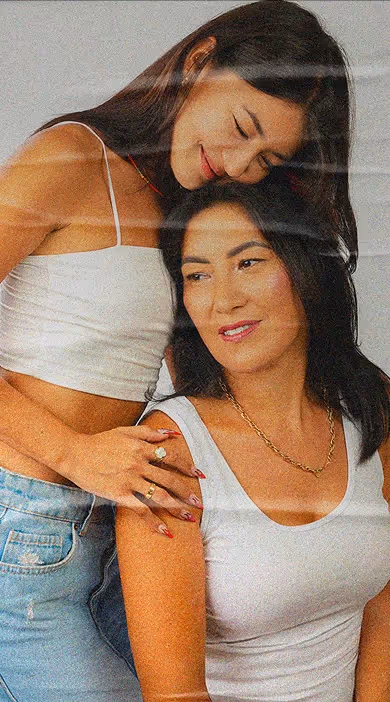 a woman hugging another woman