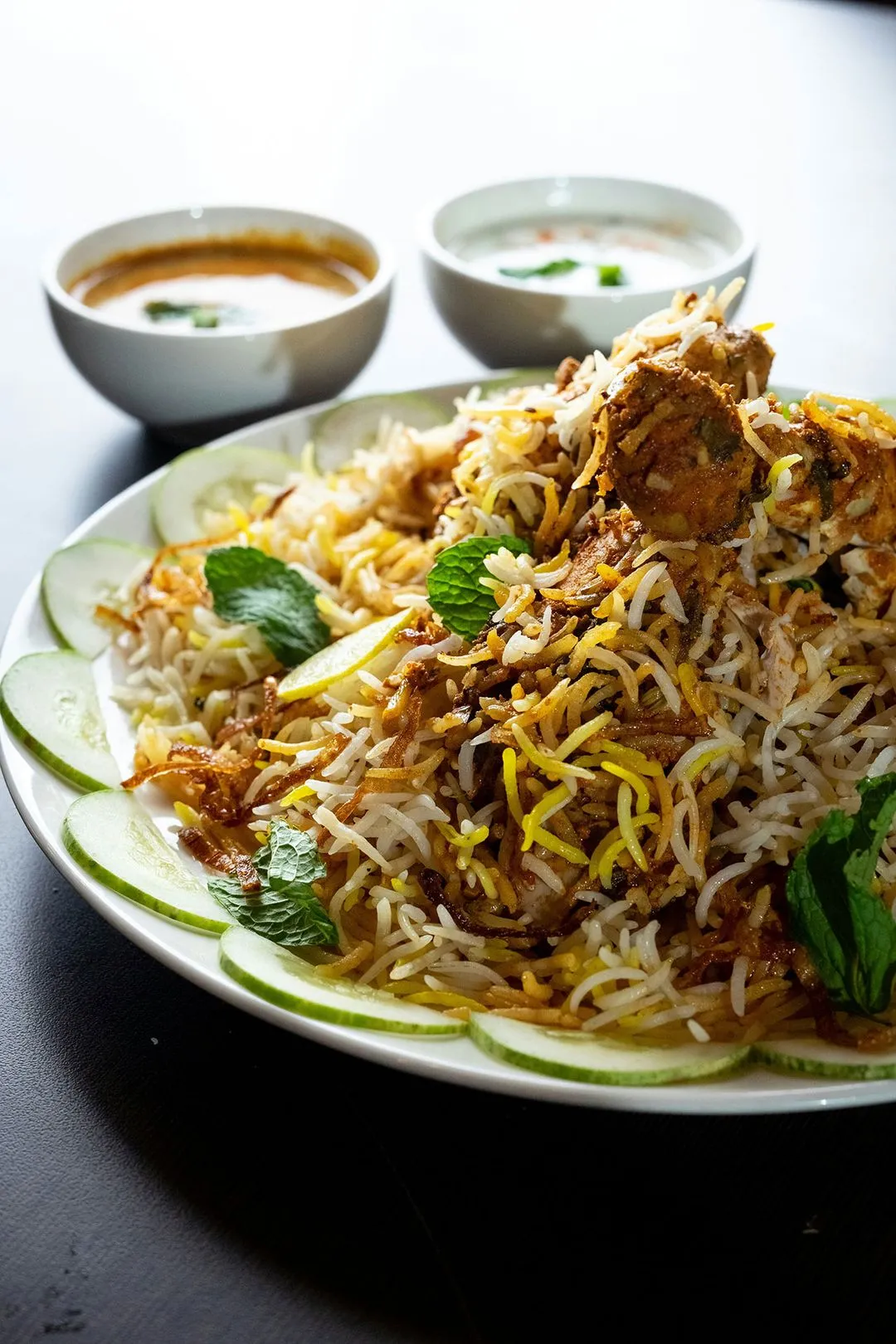 Yellow basmati rice with cucumbers and yougurt sauce