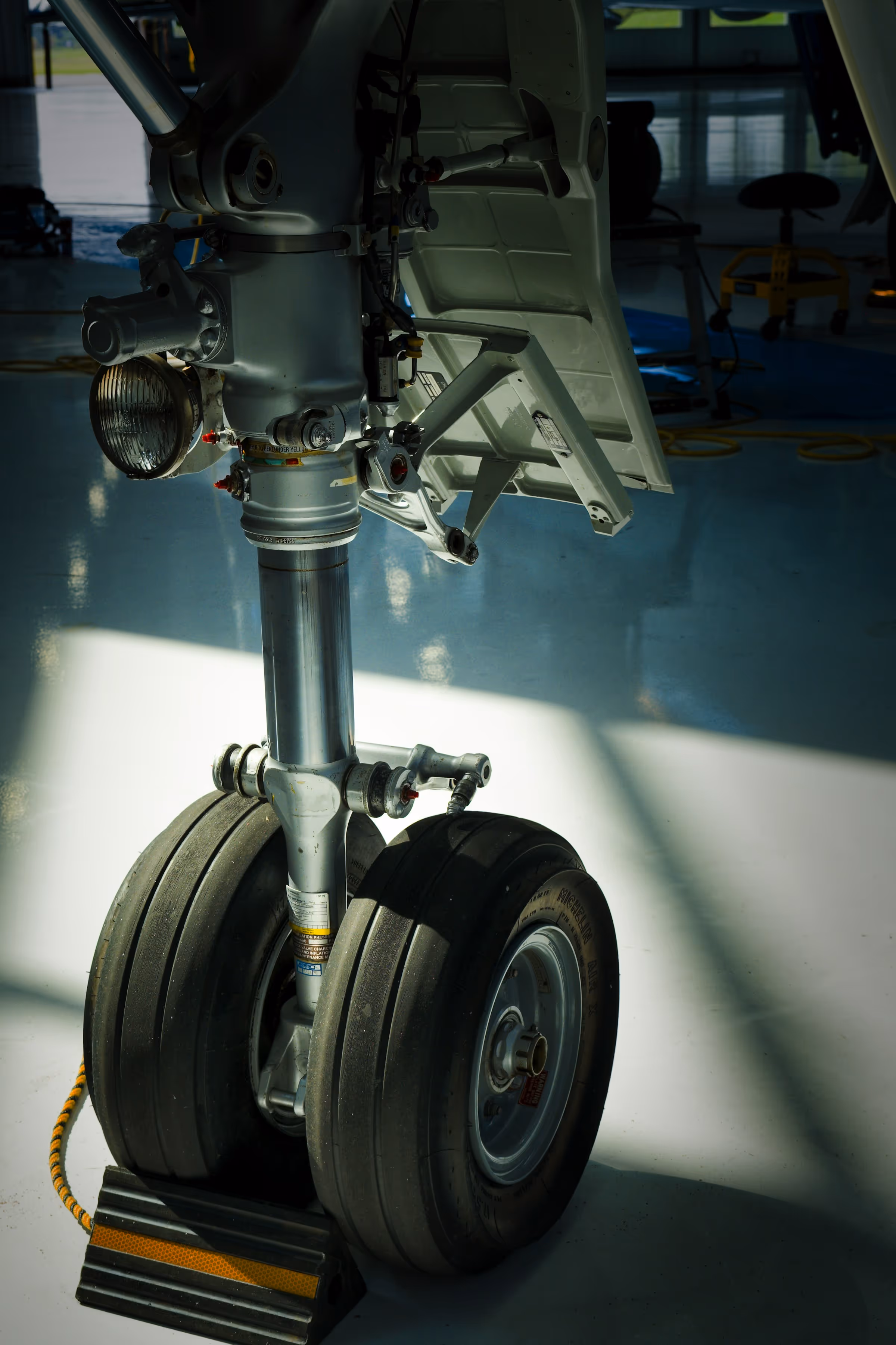 Close-up of aircraft landing gear.