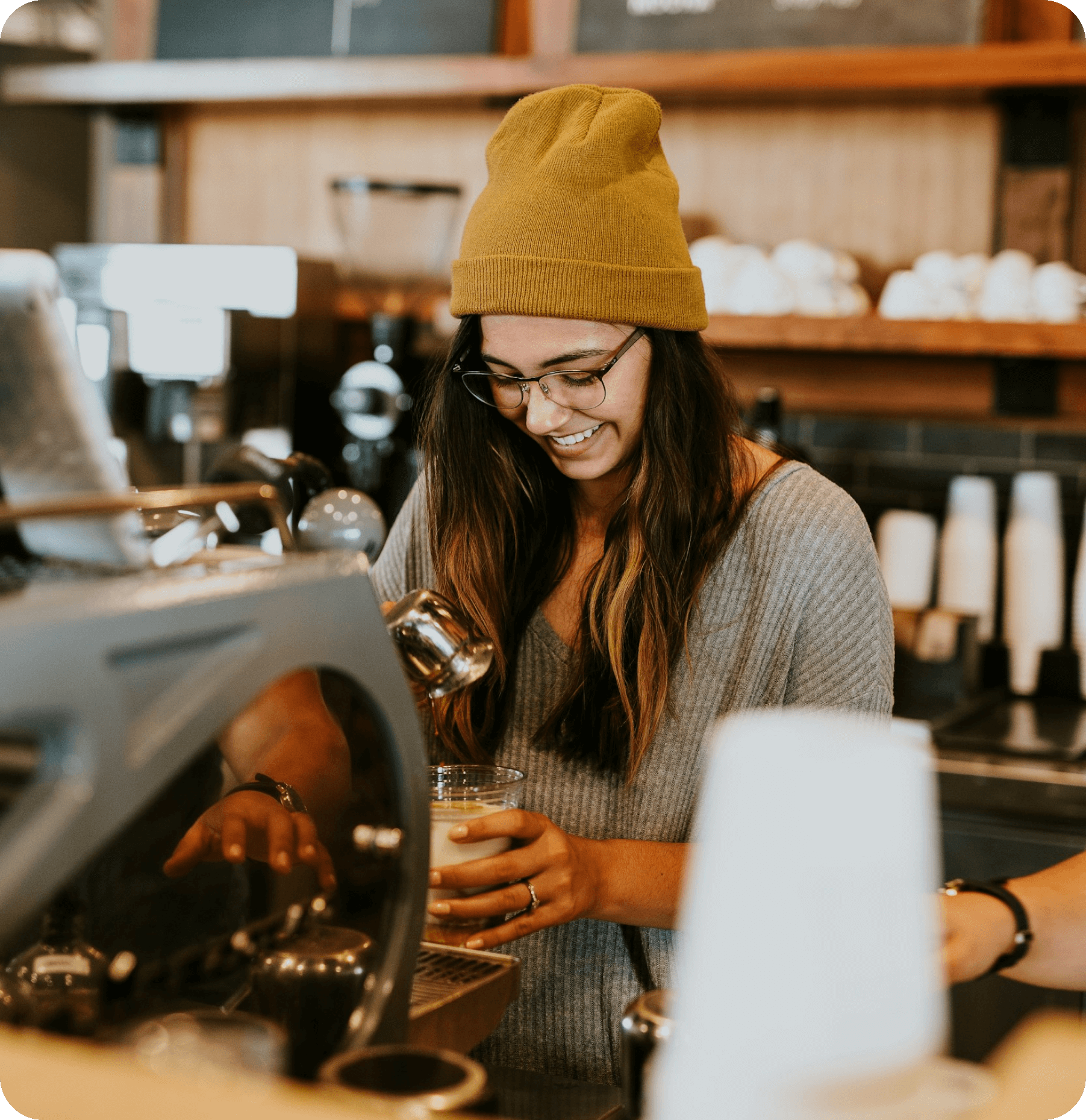 Café owner serving a smiling customer with Worthify loyalty program powering repeat visits.
