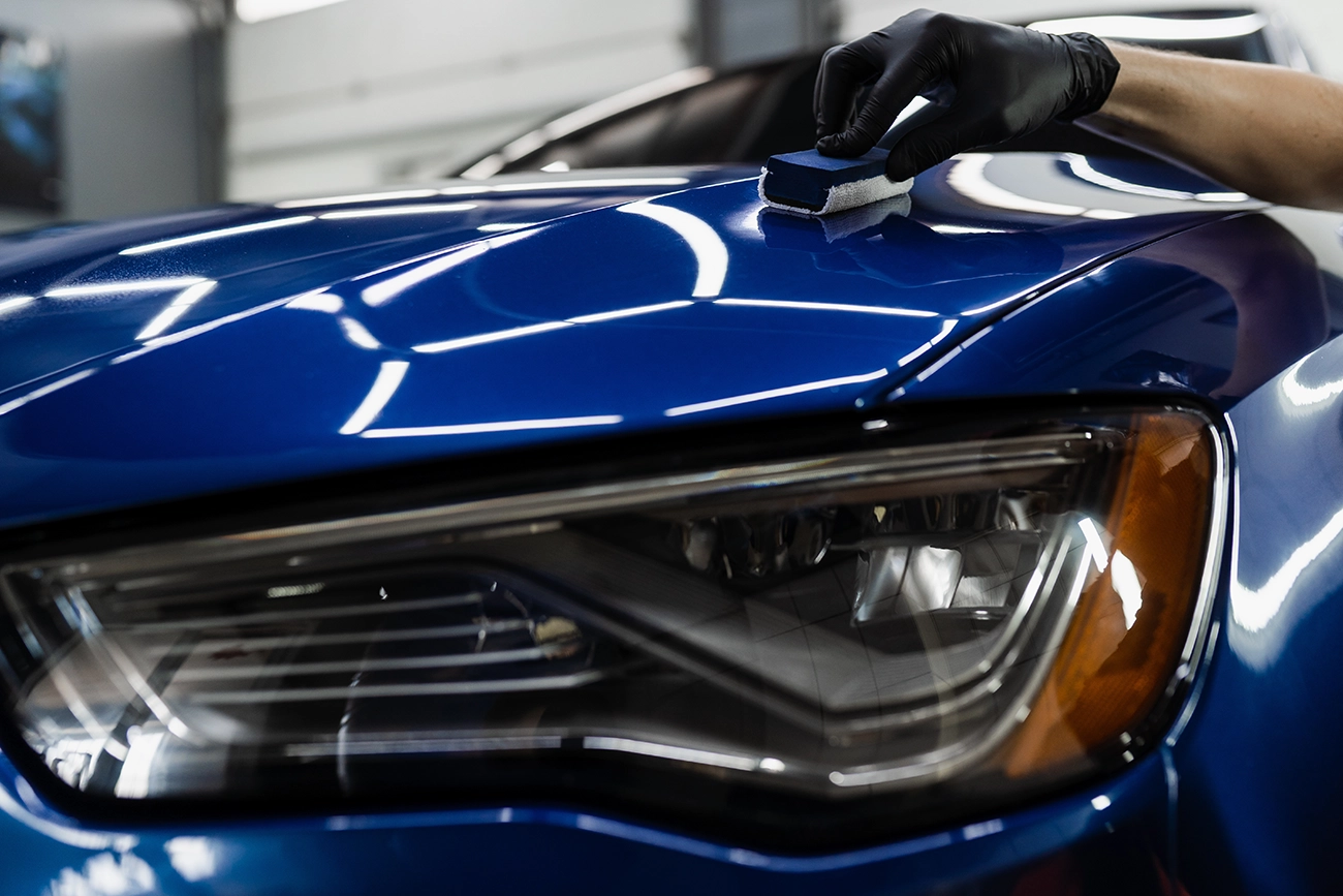 Front end of a car with clear bra protection.