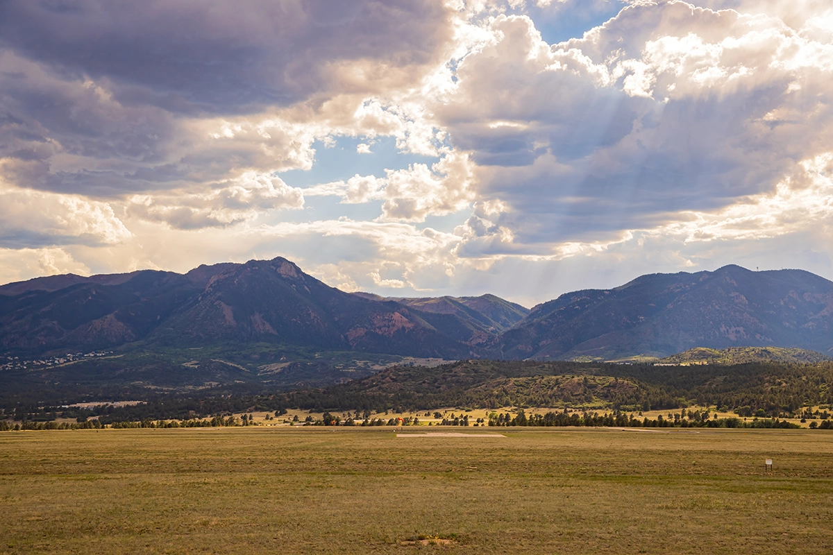Monument, Colorado landscape with Rockies in the background.