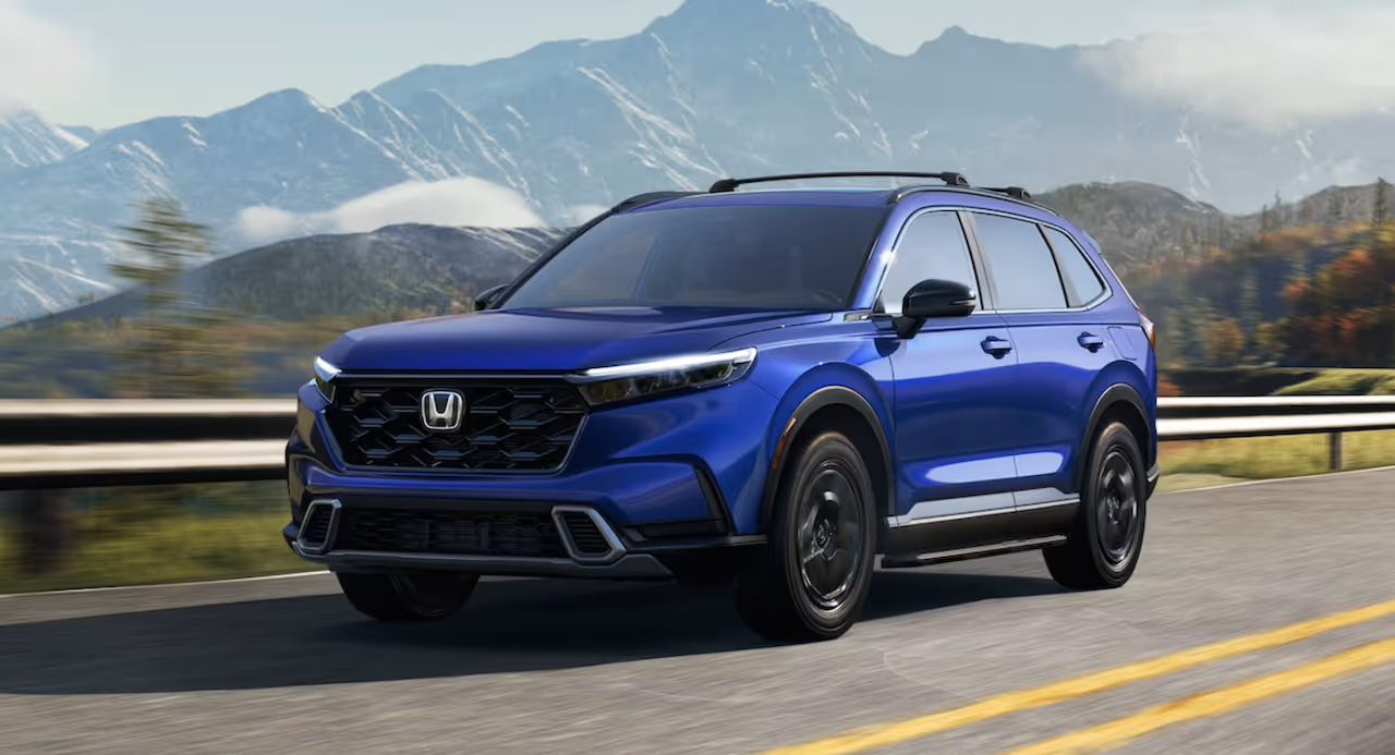 A Honda cruising through the mountains.