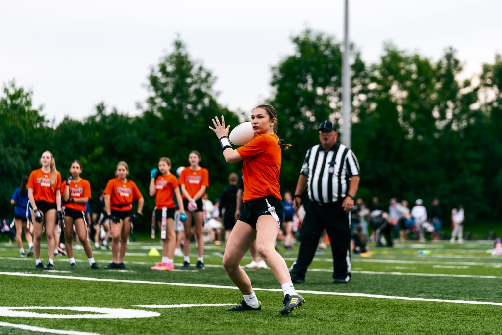 Referee officiating a flag football game