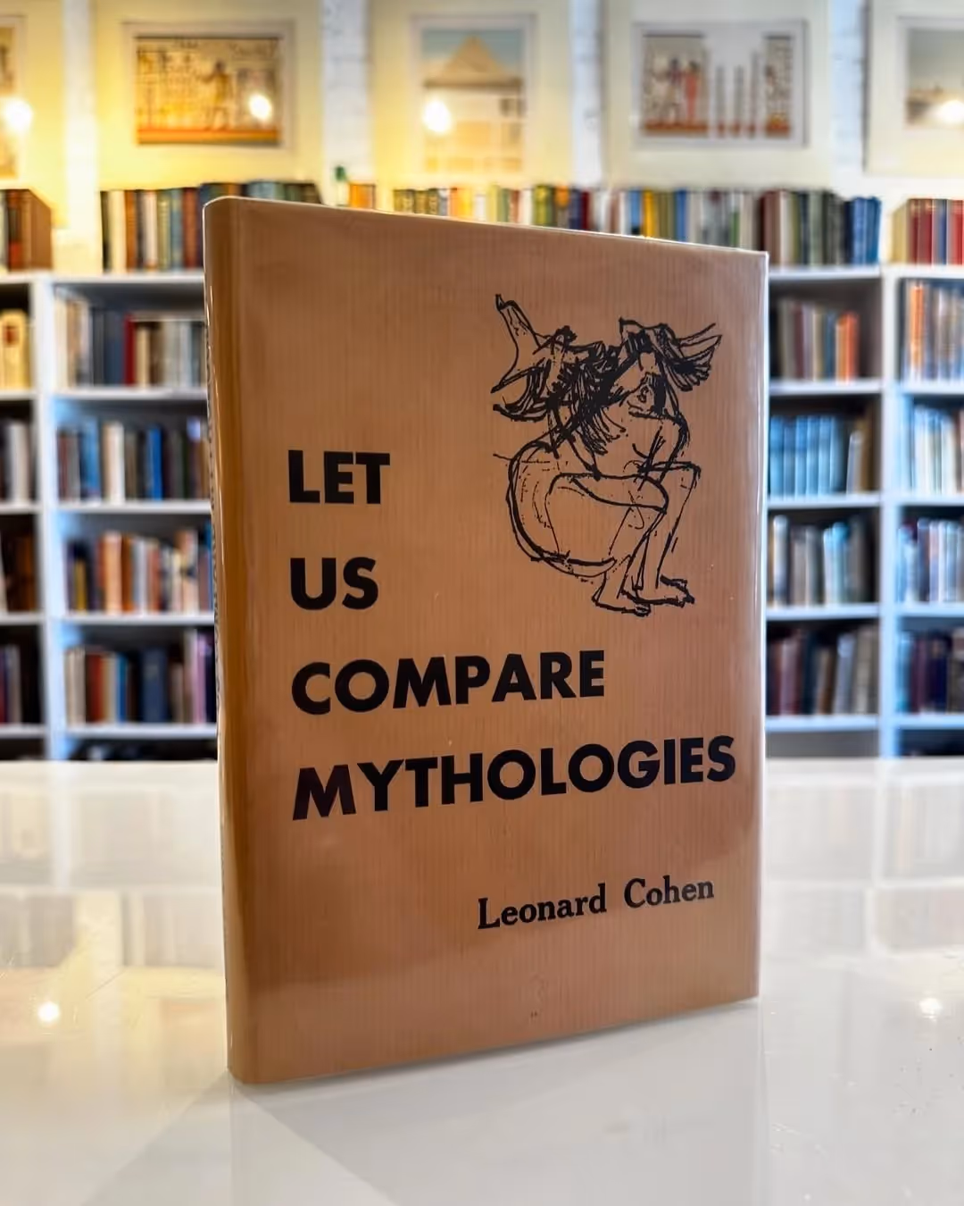 A picture of the Leonard Cohen’s debut 1956 collection Let Us Compare Mythologies first published by McGill Poetry Series and later reissued by McClelland and Stewart