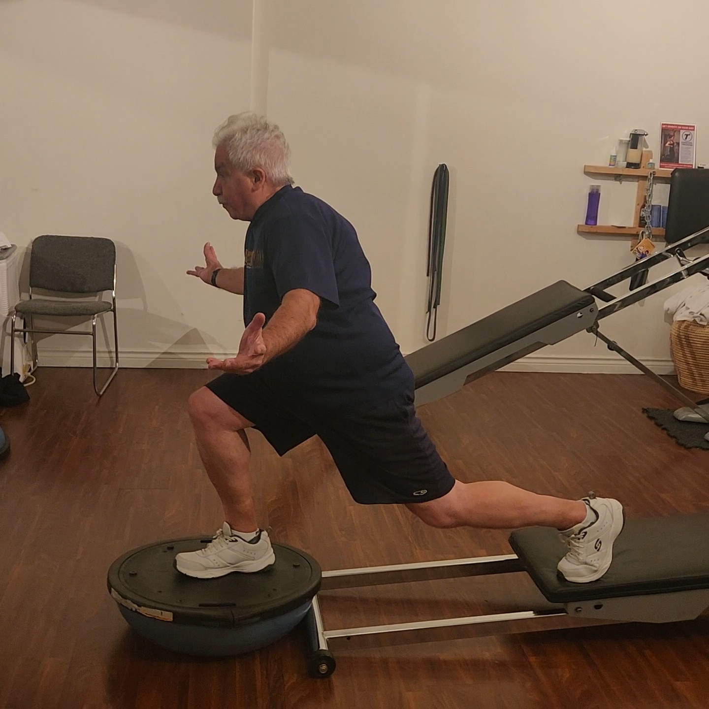 Client performing balance and stability exercises on a Total Gym at Tsquared Personal Training in Downtown Vancouver to improve coordination, core strength, and mobility for long-term health.