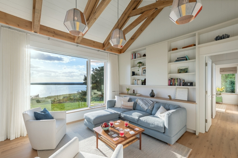 A bright cozy living room with lofted ceilings and remarkable views at Hariph's Landing
