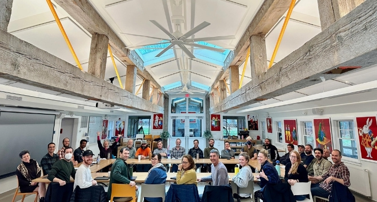 Company meeting in Camp Jabberwocky dining hall