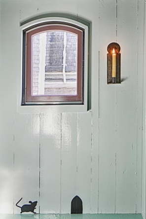 Simple paneled and painted wall and window detail.
