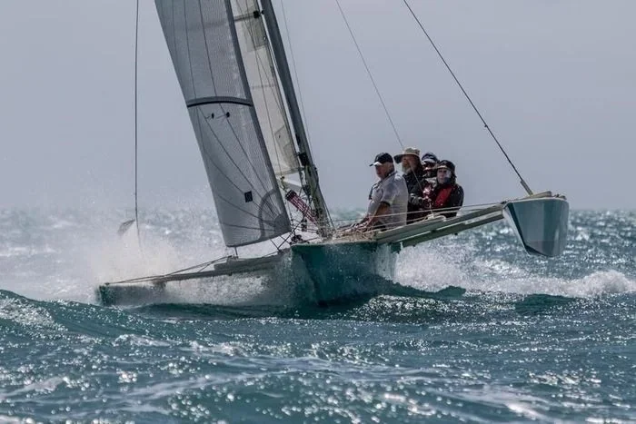 Trimaran flips at Airlie Beach Race Week – all aboard are fine
