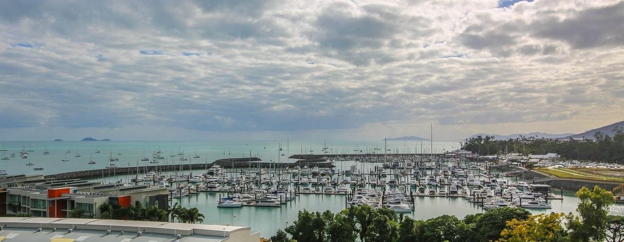 Abell Point Marina where the bulk of the fleet is staying - Photo: Vampp Photography|Hammer of Queensland - Photo: Andrew Francolini|Yarrandis' deck is filled with prominent ex-skiff sailors - Photo: Andrea Francolini